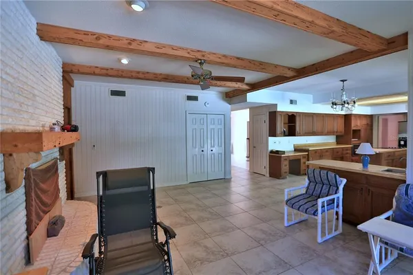 a kitchen with a table and chairs in it