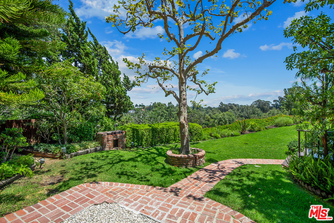 13238 Riviera Ranch Road Los Angeles, CA 90049 - Photo 28 of 28 a view of a garden with a tree