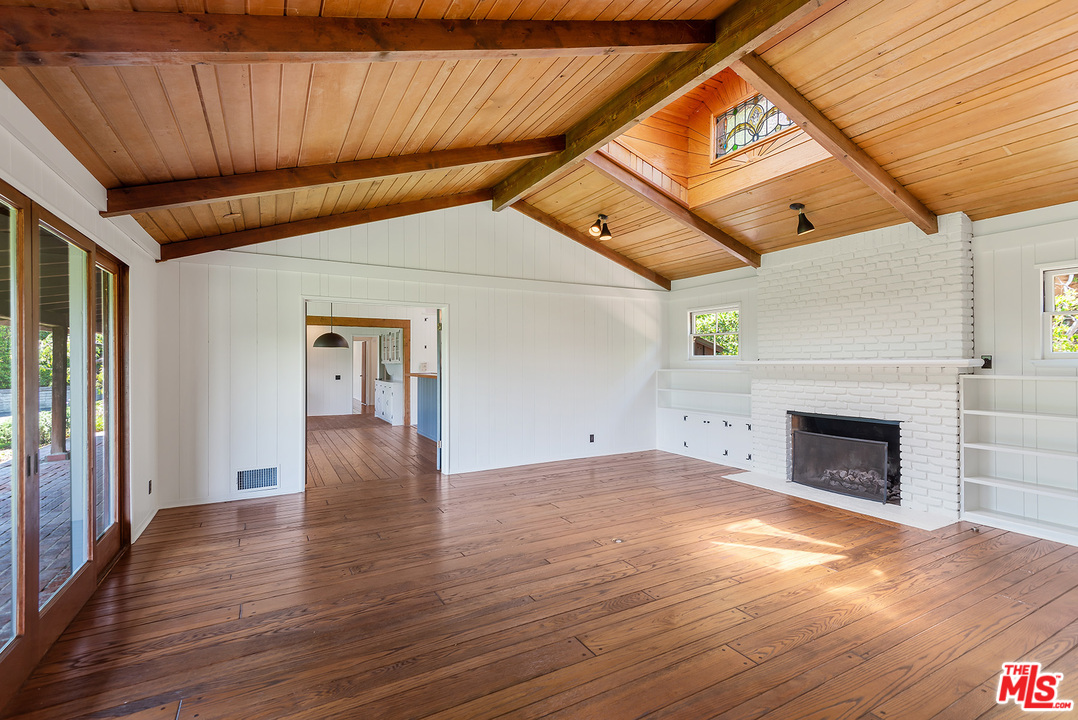 13238 Riviera Ranch Road Los Angeles, CA 90049 - Photo 6 of 28 a view of empty room with wooden floor