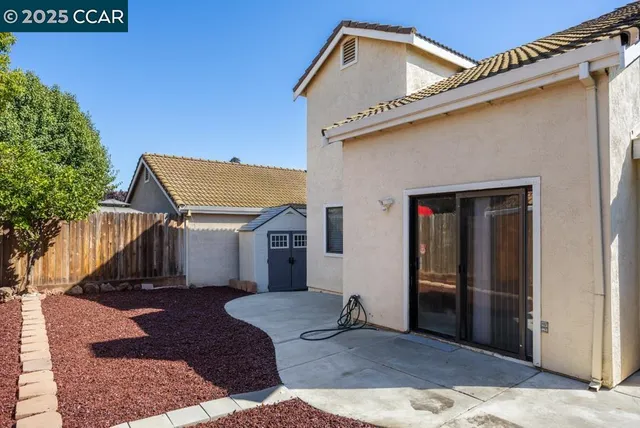 a view of a house with wooden floor and fence