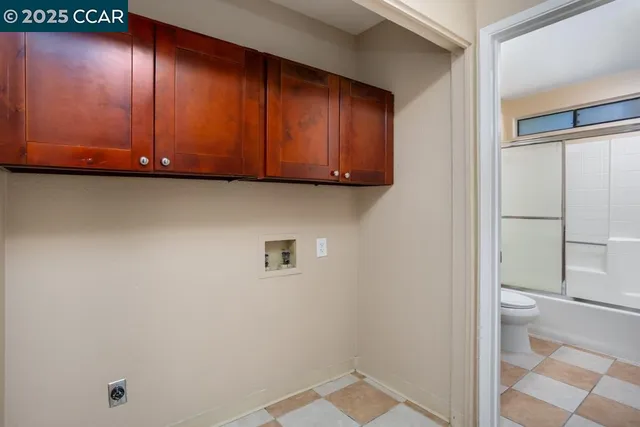a view of an empty room and wooden floor