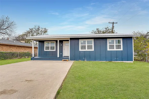 a front view of a house with yard