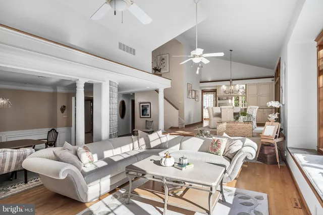 a view of a room with wooden floor and window
