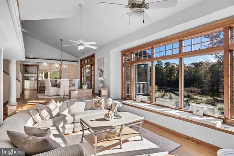a bathroom with a granite countertop sink a toilet and a mirror
