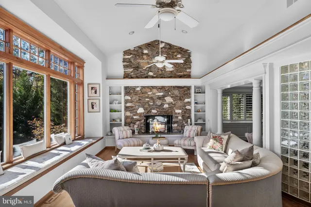 a view of a chair and tables in the balcony