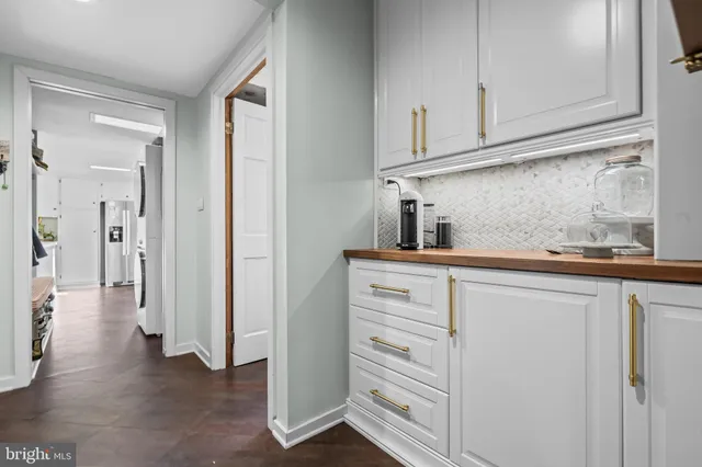 a bathroom with a sink double vanity and a mirror