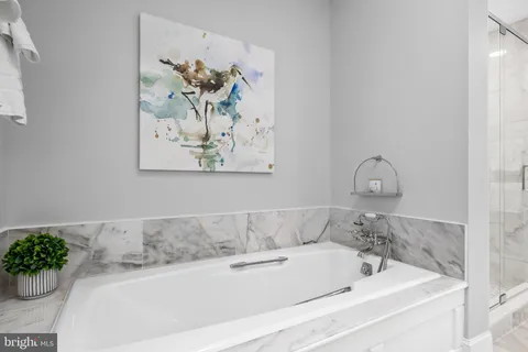 an aerial view of a house with yard basket ball court and outdoor seating