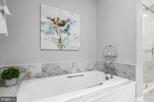 an aerial view of a house with yard basket ball court and outdoor seating