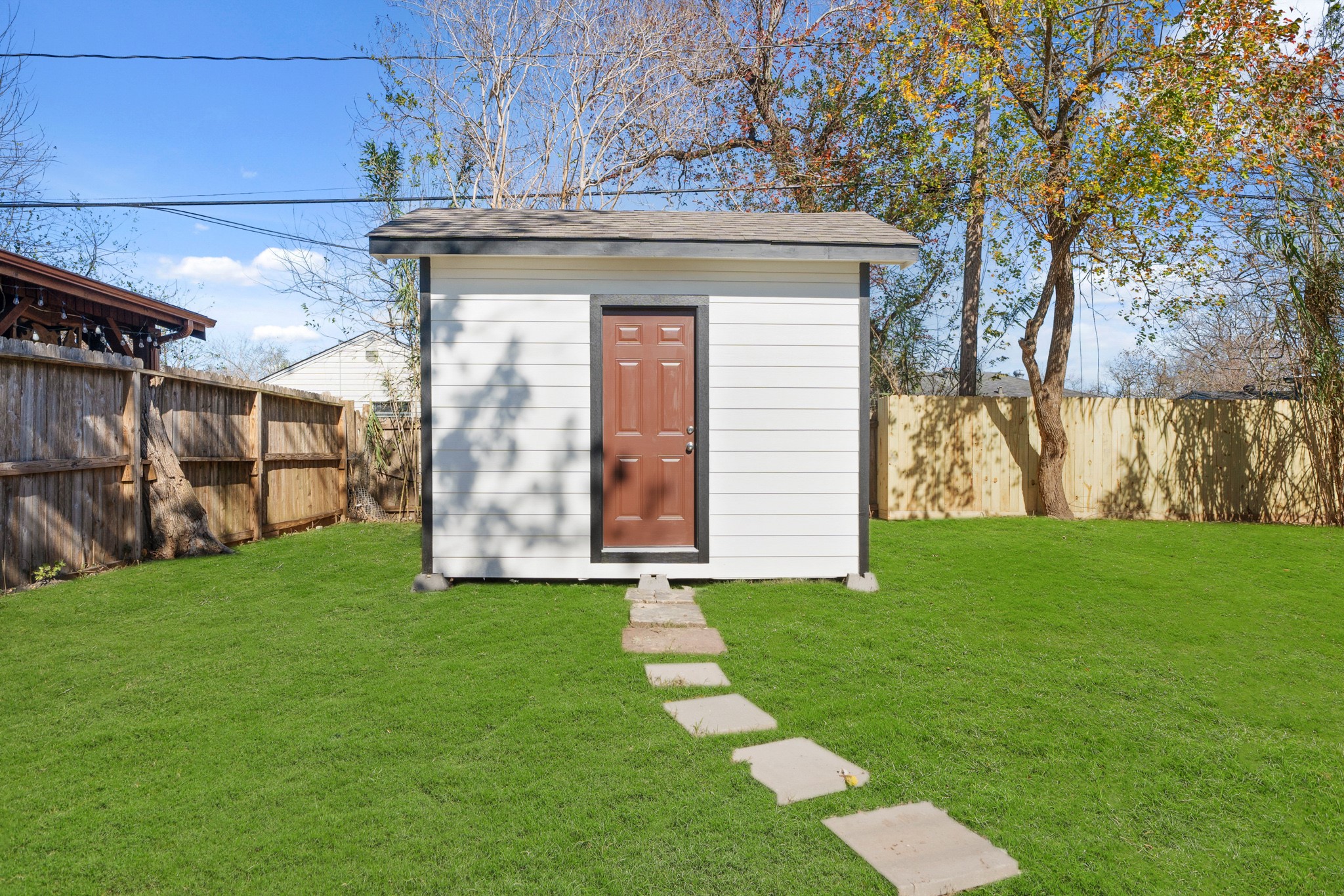 5123 Ridgeway Drive Houston, TX 77033 - Photo 19 of 21 The backyard features a storage shed too.