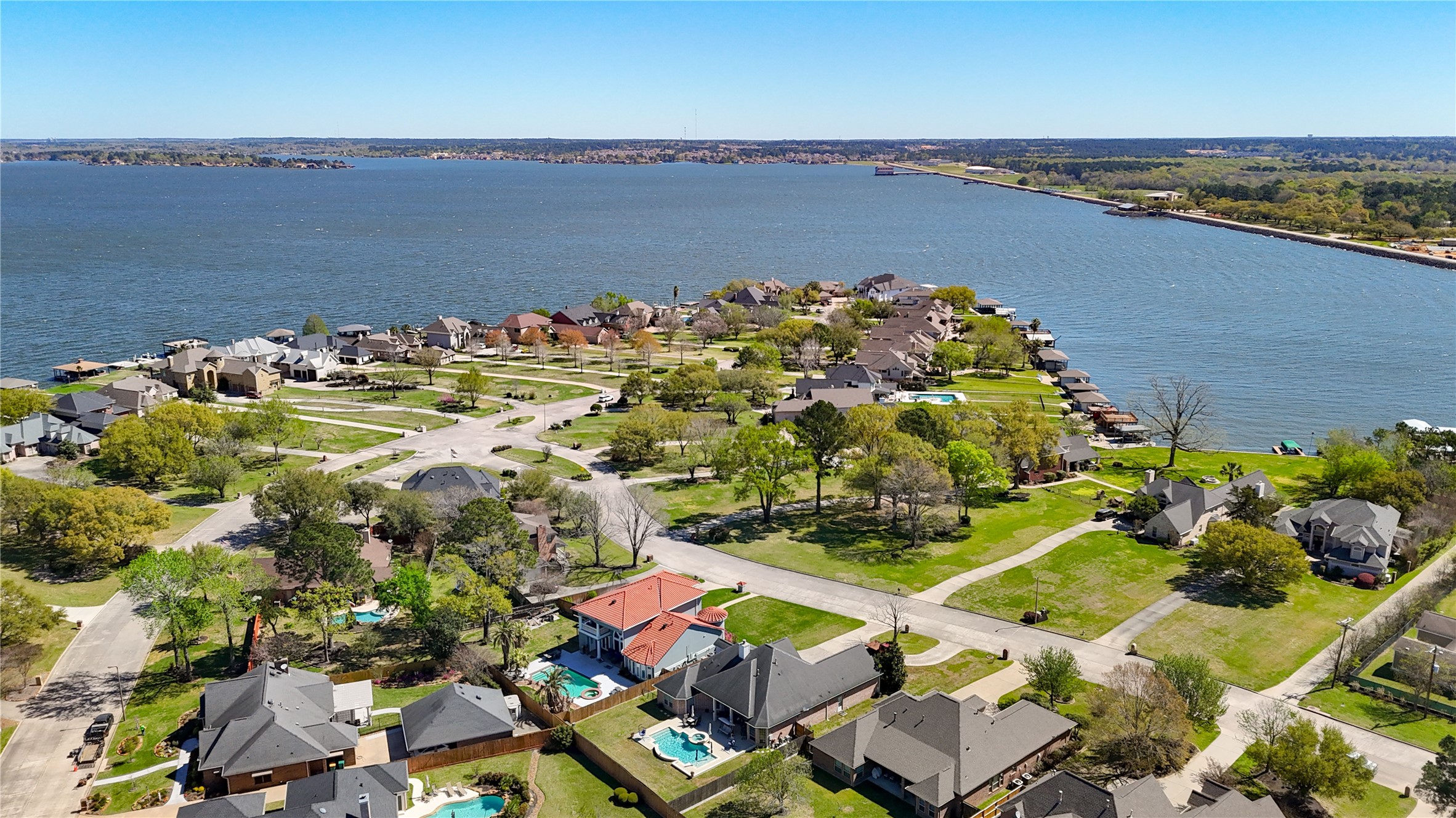 90 Beach Walk Boulevard Conroe, TX 77304 - Photo 20 of 26 an aerial view of a houses with a lake view