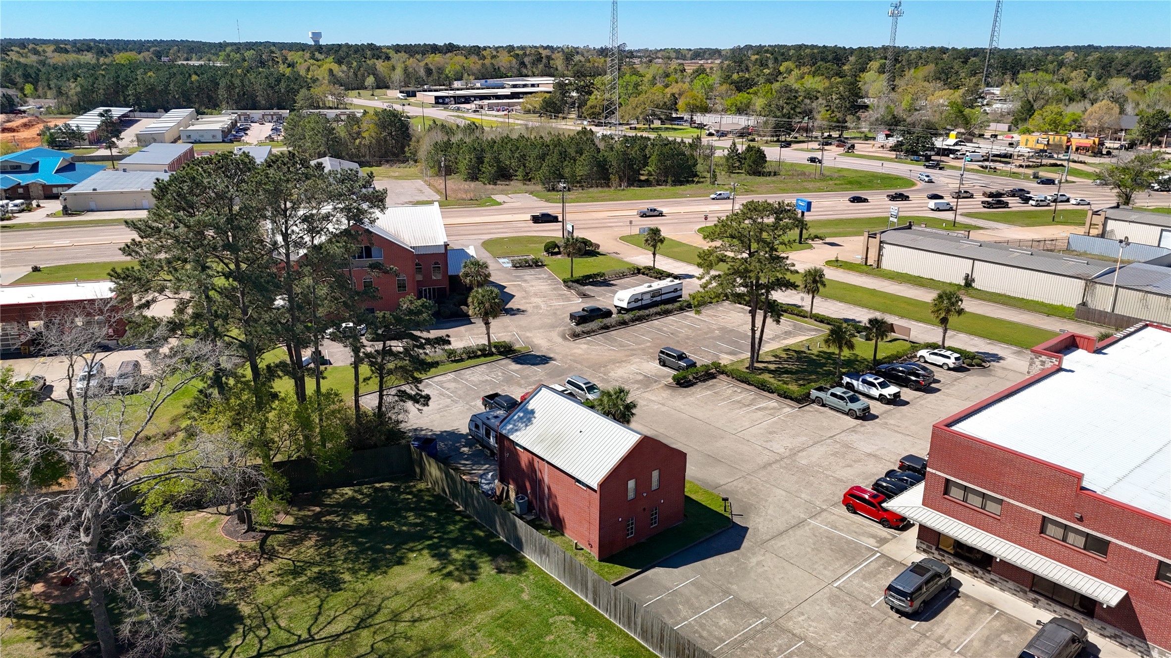 90 Beach Walk Boulevard Conroe, TX 77304 - Photo 25 of 26 an aerial view of a house with a lake view