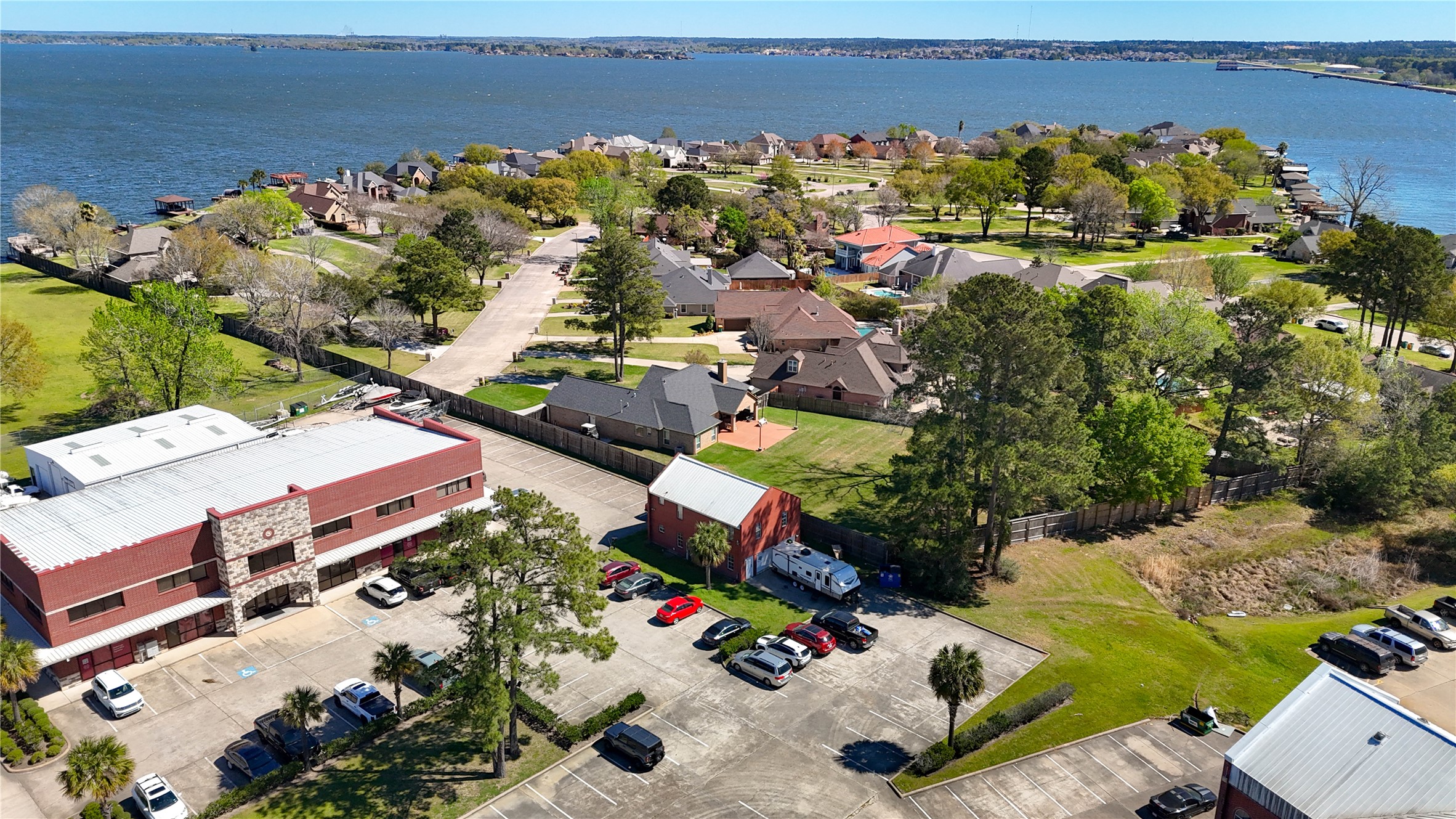 90 Beach Walk Boulevard Conroe, TX 77304 - Photo 8 of 26 an aerial view of a houses with a lake view