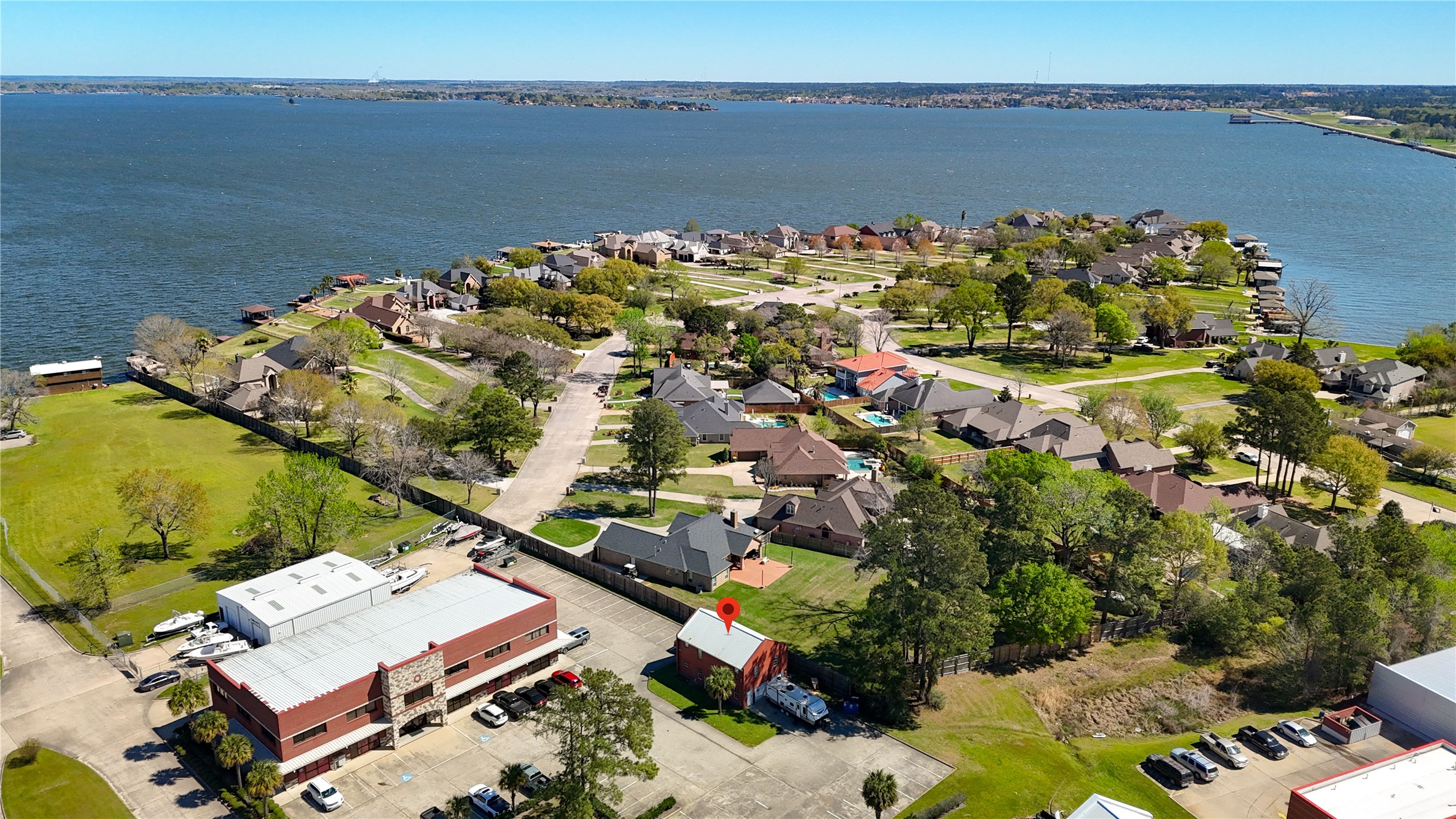 90 Beach Walk Boulevard Conroe, TX 77304 - Photo 9 of 26 an aerial view of a house with a lake view