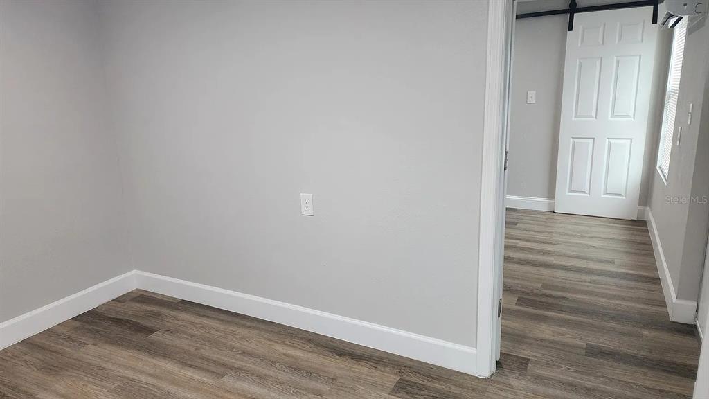 837 Ethyl Street, Unit B Brandon, FL 33511 - Photo 11 of 12 a view of a small space with wooden floor