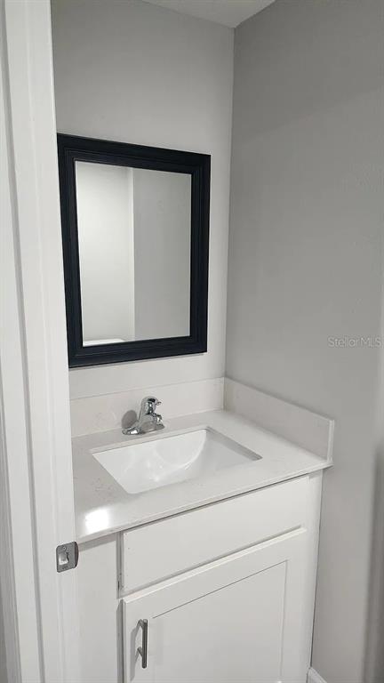 837 Ethyl Street, Unit B Brandon, FL 33511 - Photo 6 of 12 a bathroom with a sink and a mirror