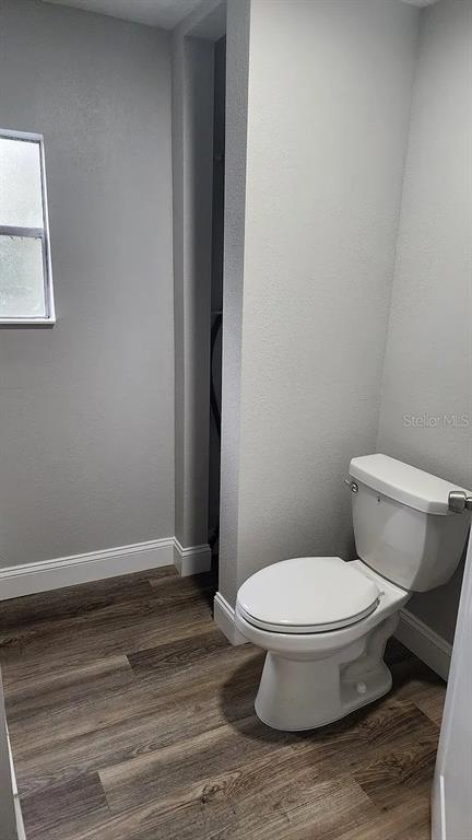 837 Ethyl Street, Unit B Brandon, FL 33511 - Photo 7 of 12 a white toilet sitting next to a shower