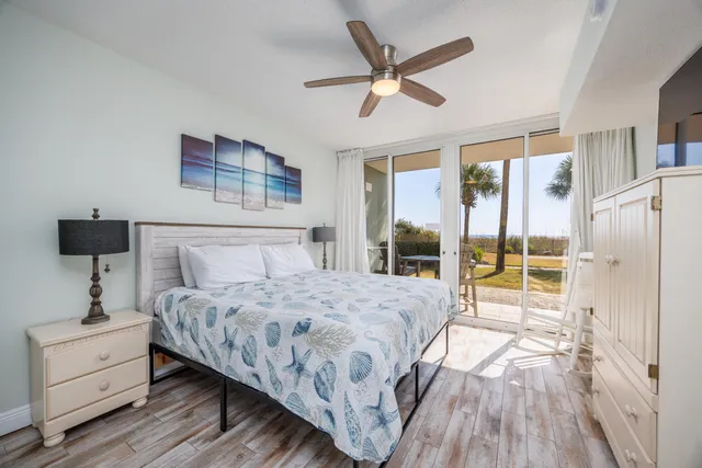 a bedroom with a large bed and a window