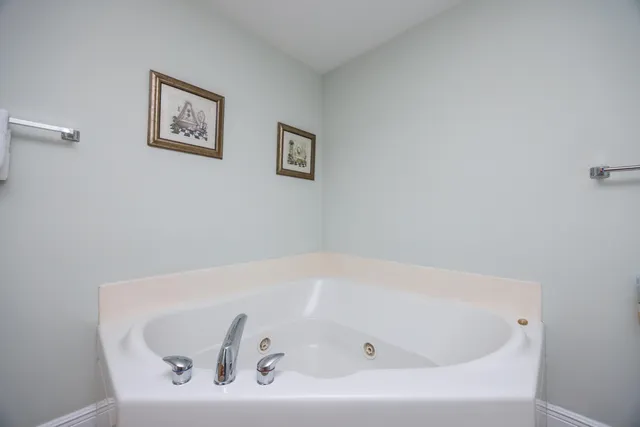 a white bath tub sitting in a bathroom