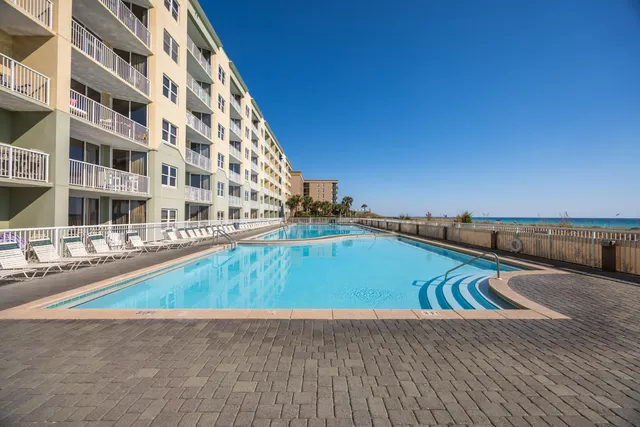 a view of swimming pool with chairs