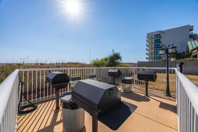 a view of a balcony with chairs
