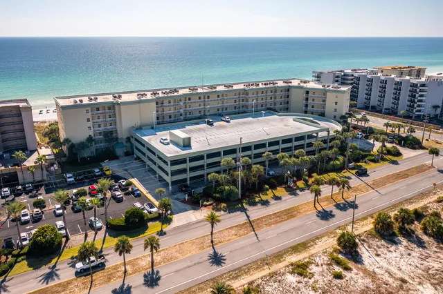 a balcony with a table and chairs