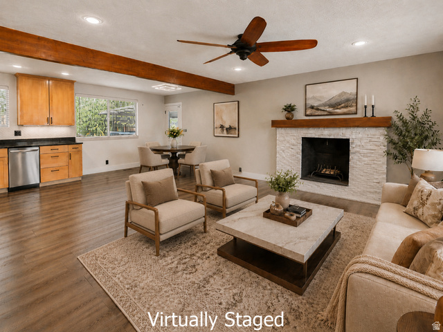 2693 Teal Way Sandy, UT 84093 - Photo 6 of 50 Open-concept living area featuring a stone-clad fireplace with a wood mantel, wood-finish flooring, and exposed ceiling beams