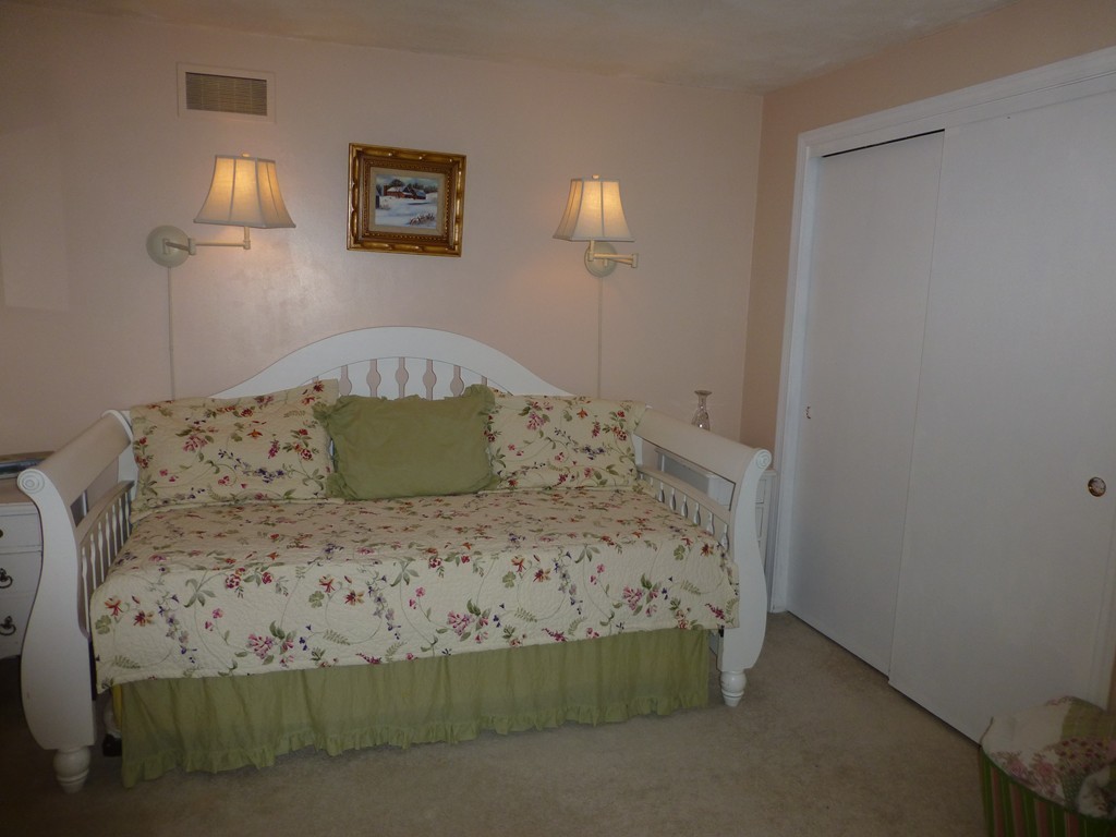 91 Drummer Road, Unit 91 Acton, MA 01720 - Photo 13 of 17 a bed sitting in a bedroom and painting on the wall