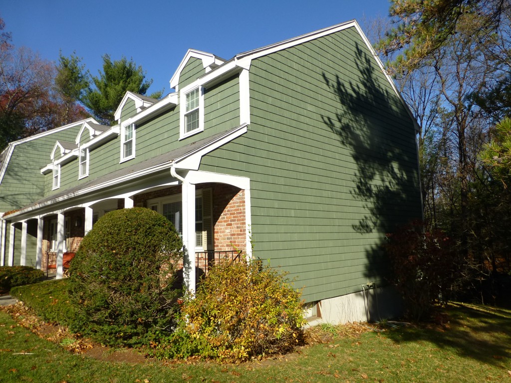 91 Drummer Road, Unit 91 Acton, MA 01720 - Photo 3 of 17 a front view of a house with garden