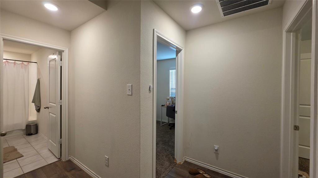 409 Samuel Street Denton, TX 76207 - Photo 5 of 40 an empty room with an entrance to other room