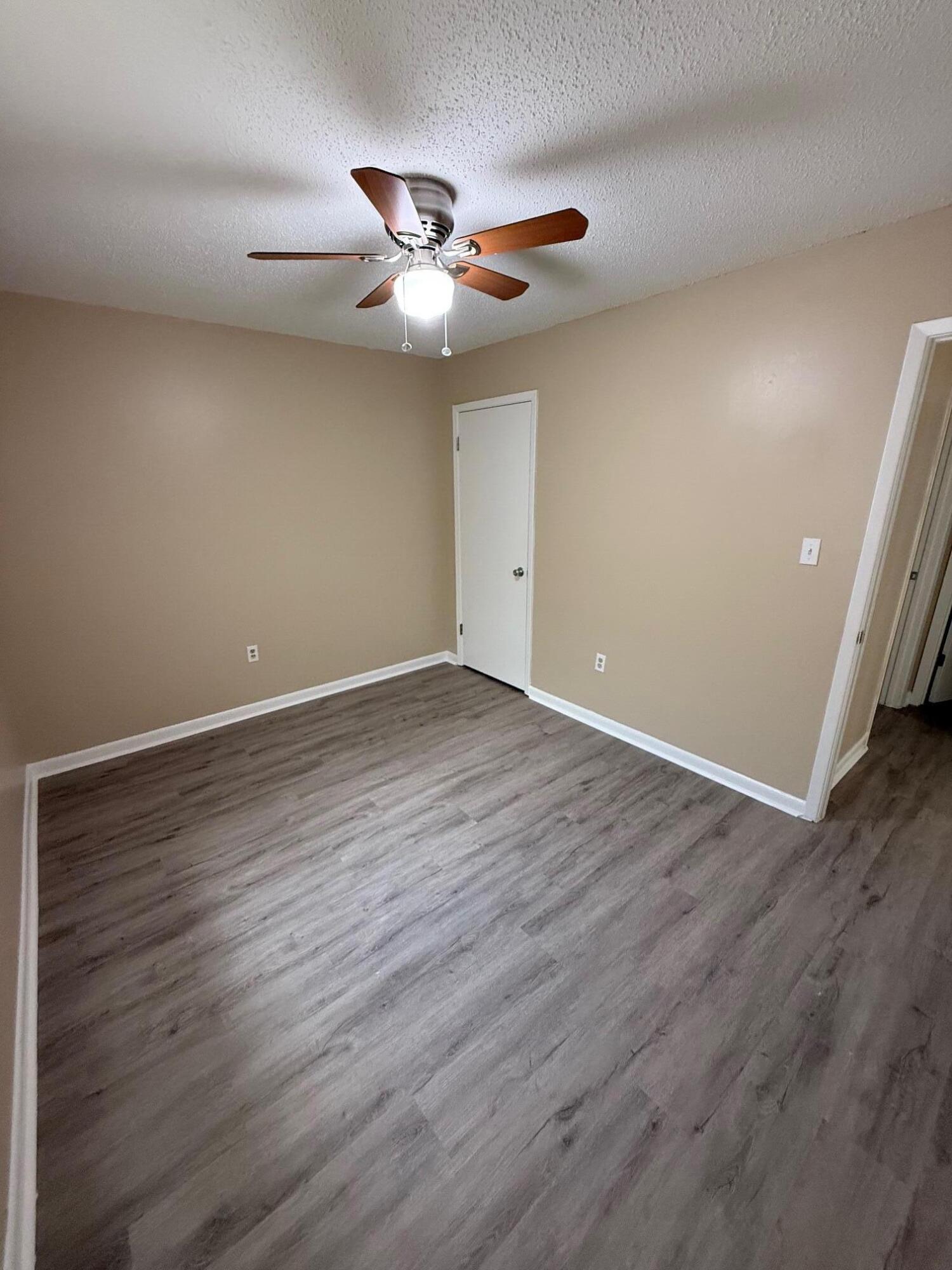 830 Cardinal Street, Unit 2 Fort Walton Beach, FL 32547 - Photo 7 of 11 a view of an empty room with wooden floor