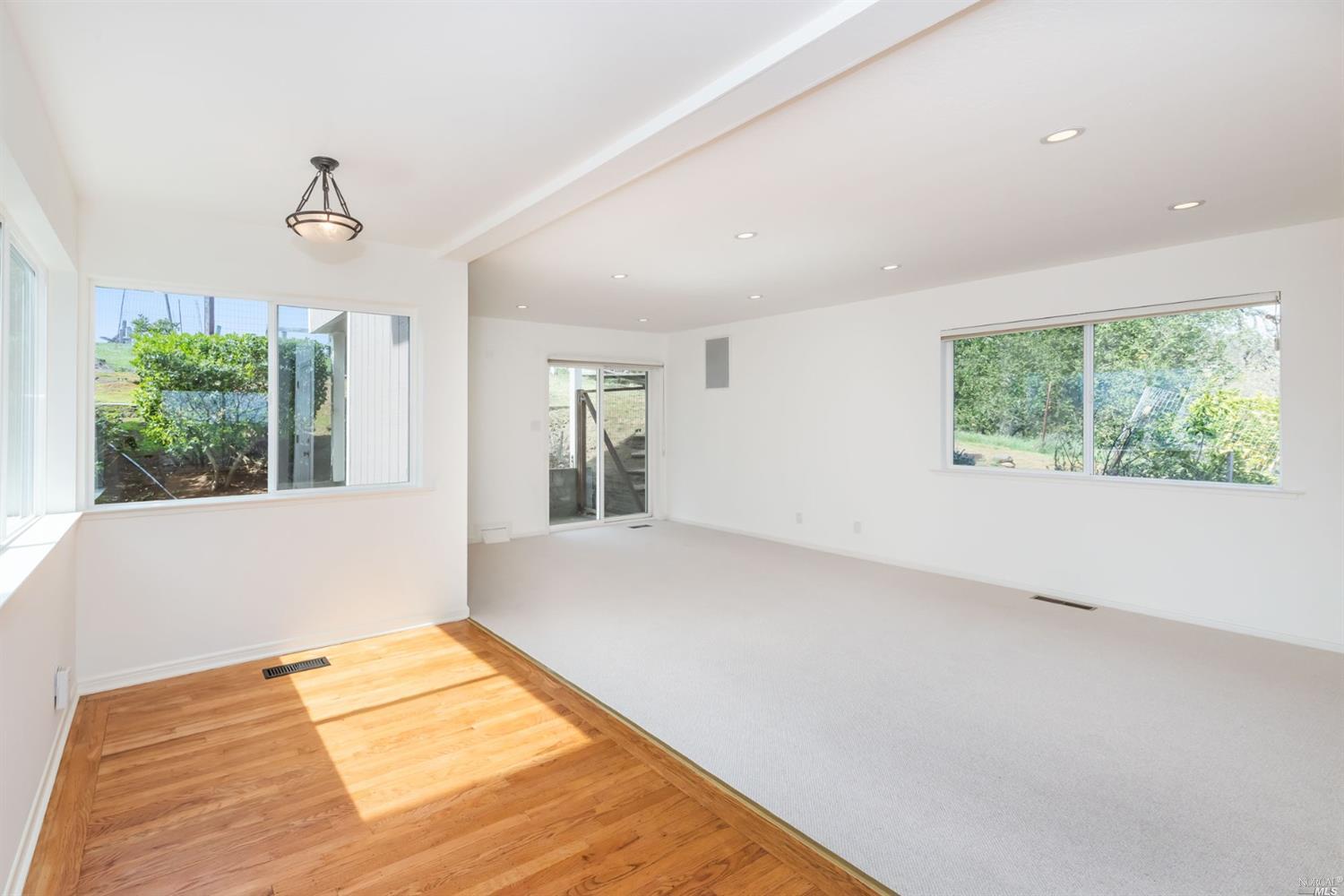 104 Bryan Drive Novato, CA 94945 - Photo 16 of 38 Large family room off kitchen with sliding glass door to the outside.