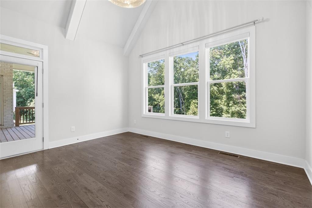 3528 North Bogan Road Buford, GA 30519 - Photo 17 of 79 an empty room with wooden floor and windows