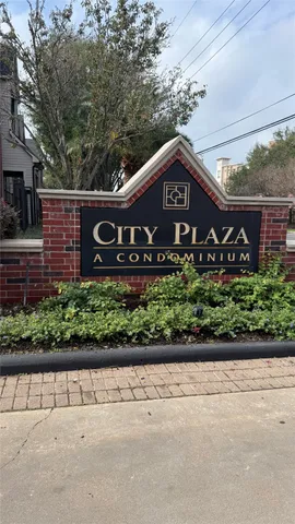 a sign that is sitting on a wooden wall