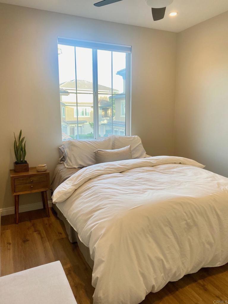 69 Via Sovana Santee, CA 92071 - Photo 11 of 17 a bedroom with a bed and wooden floor