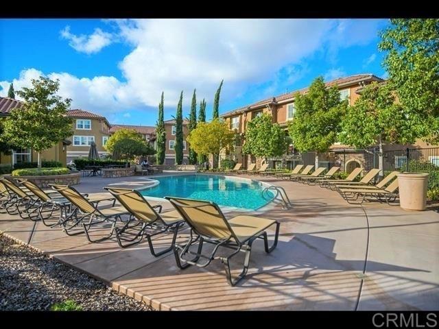 69 Via Sovana Santee, CA 92071 - Photo 16 of 17 a swimming pool with outdoor seating and yard