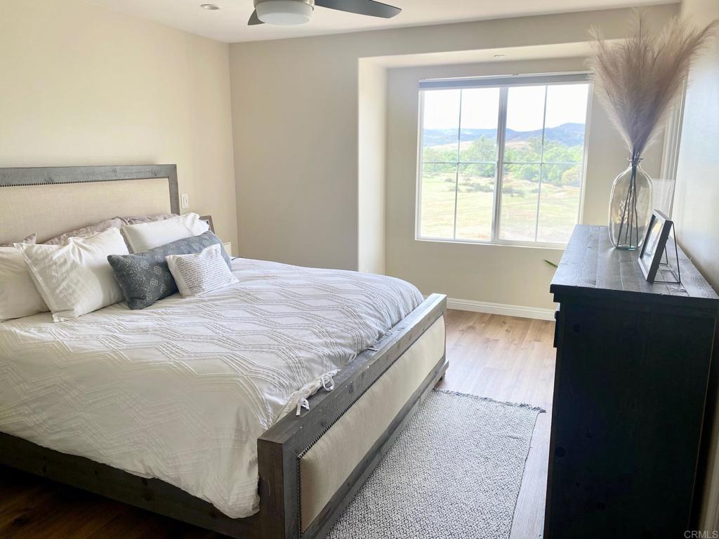 69 Via Sovana Santee, CA 92071 - Photo 8 of 17 a bedroom with a bed and a window