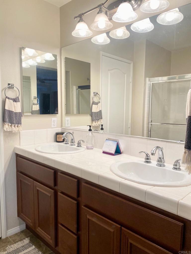 69 Via Sovana Santee, CA 92071 - Photo 9 of 17 a bathroom with a sink and a mirror