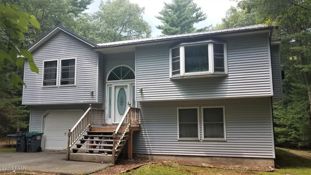 185 Fox Road Dingmans Ferry, PA 18328 - Photo 1 of 19 a front view of a house with balcony