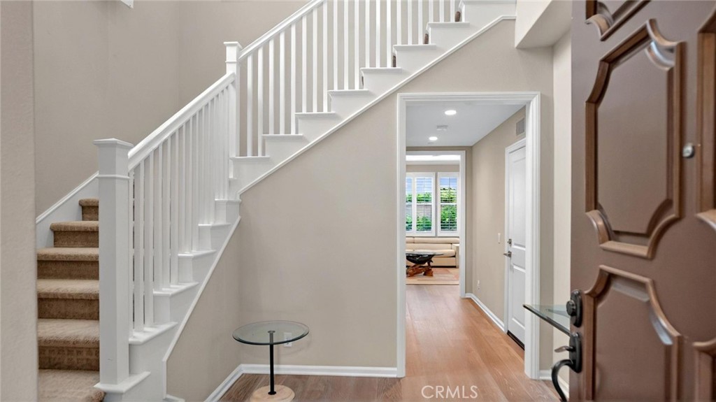 128 Gulfstream Irvine, CA 92620 - Photo 2 of 15 a view of entryway and hall with wooden floor