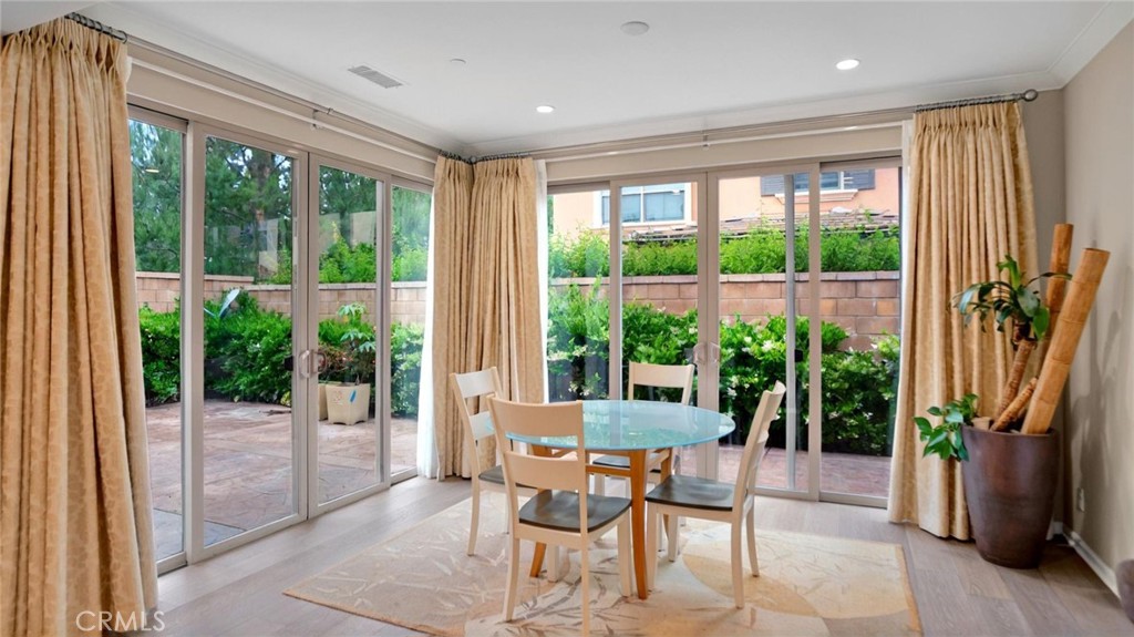 128 Gulfstream Irvine, CA 92620 - Photo 7 of 15 a dining room with furniture water view and a floor to ceiling window