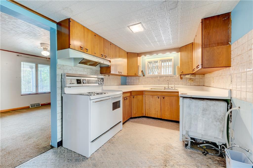 496 Laureldale Road Grindstone, PA 15442 - Photo 4 of 25 a kitchen with a sink cabinets and window