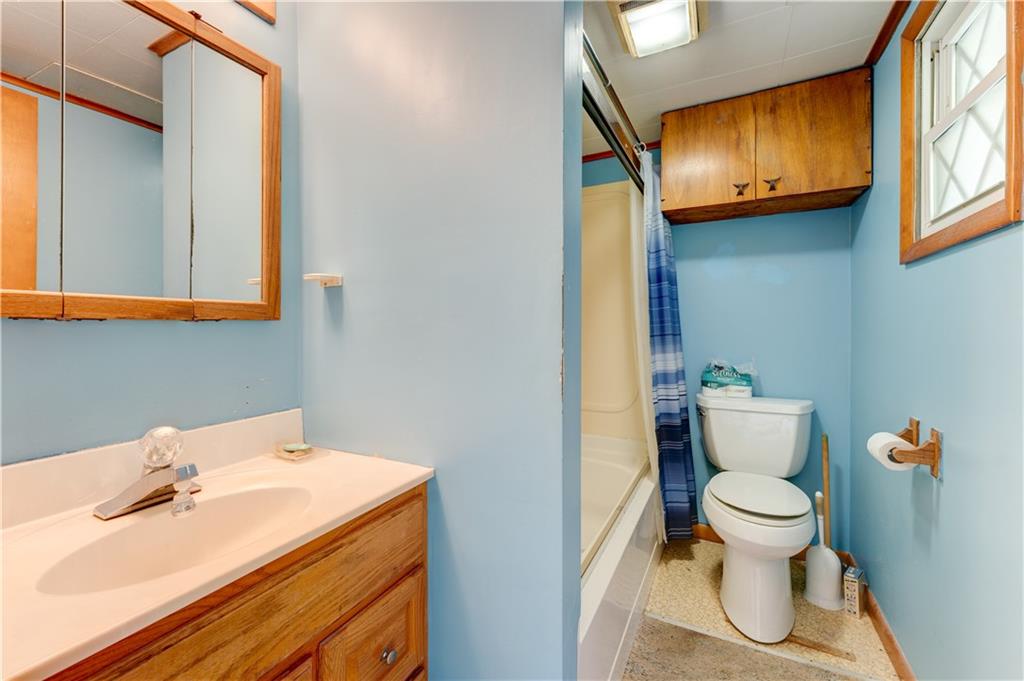 496 Laureldale Road Grindstone, PA 15442 - Photo 5 of 25 a bathroom with a sink toilet and a mirror