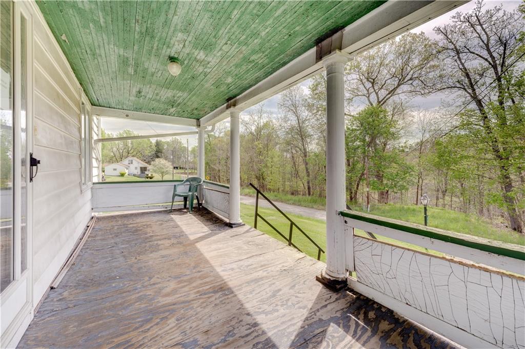 496 Laureldale Road Grindstone, PA 15442 - Photo 8 of 25 a view of a porch with wooden floor and outdoor space