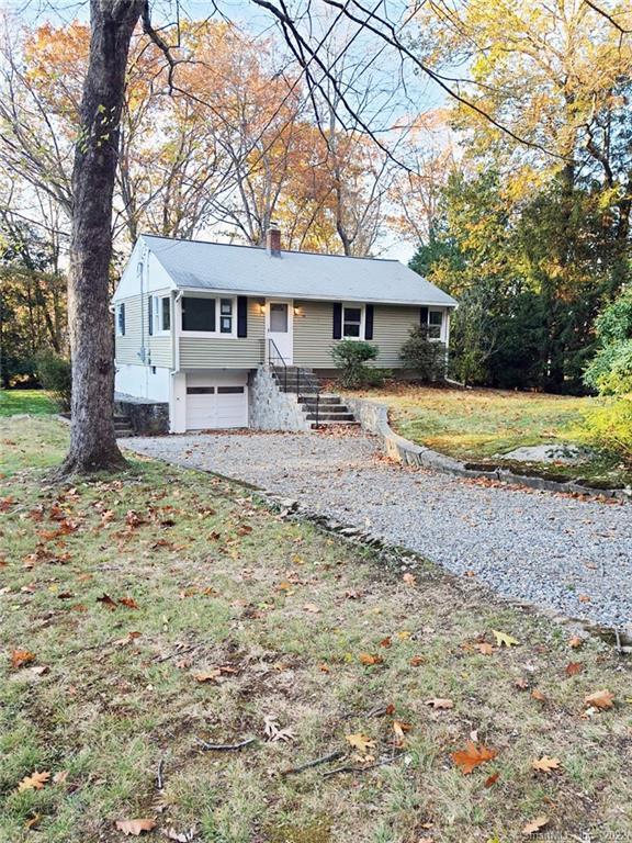 39 Verna Road Monroe, CT 06468 - Photo 1 of 1 a front view of a house with a yard and trees