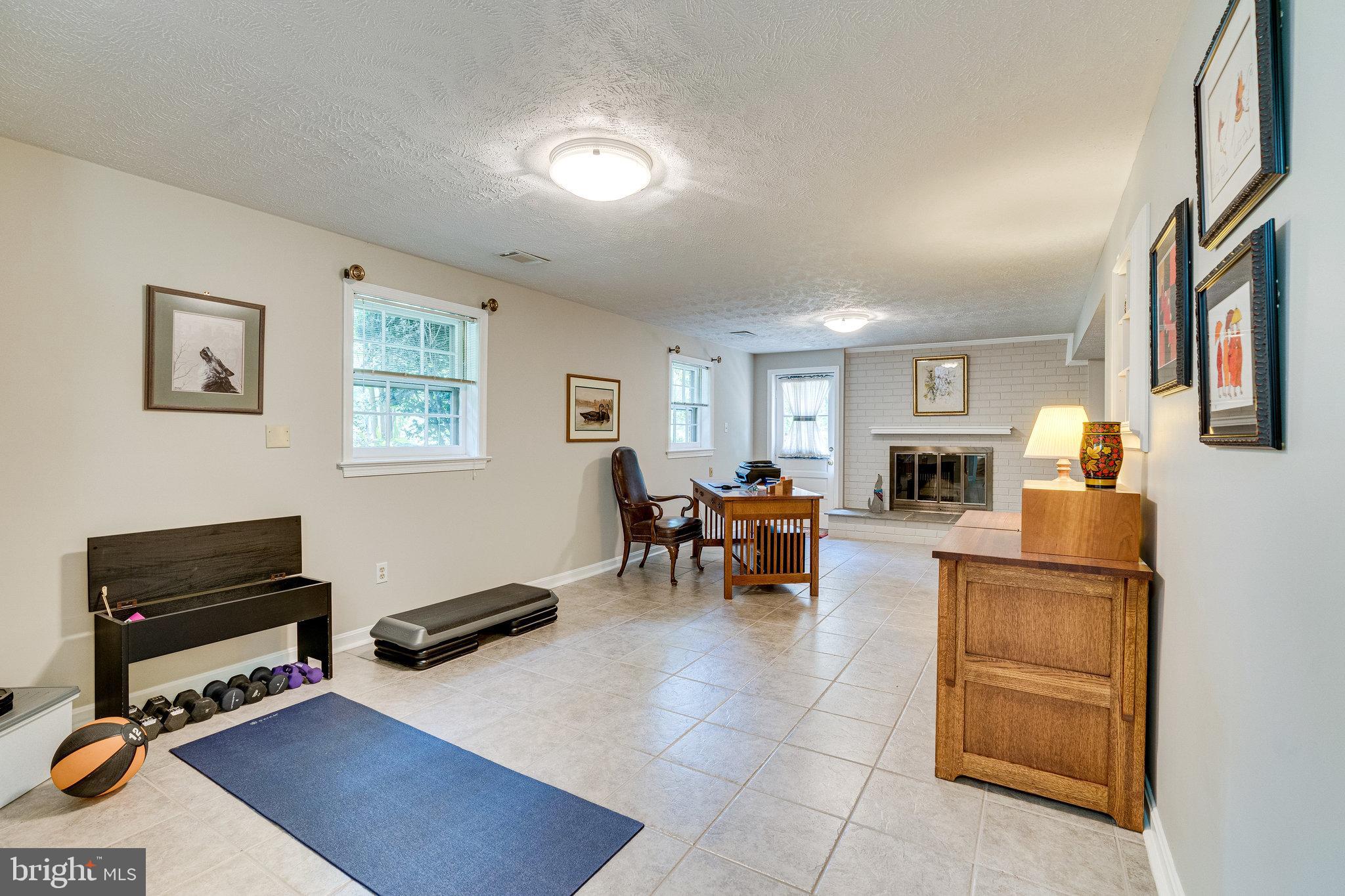 11605 Vale Road Oakton, VA 22124 - Photo 45 of 68 Recreation Room Flex Space w/Fireplace