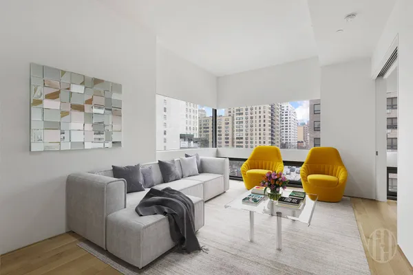 a living room with furniture and a lamp