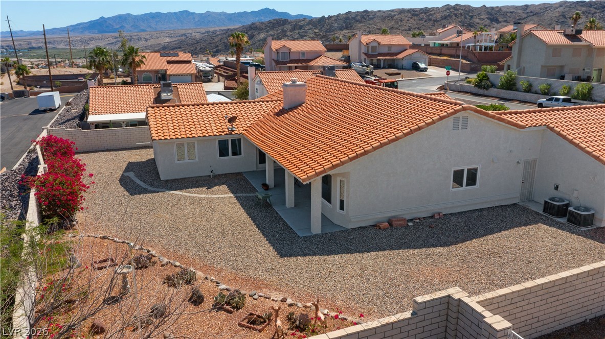 2055 Cholla Way Laughlin, NV 89029 - Photo 75 of 87 Terracotta roof tiles crown this desert oasis, surrounded by a low-maintenance, rock-filled yard.