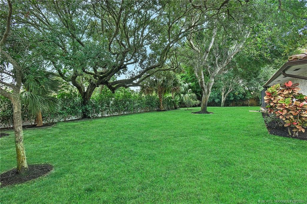 6 Copaire Road Sewall's Point, FL 34996 - Photo 11 of 76 a view of green field with trees in the background