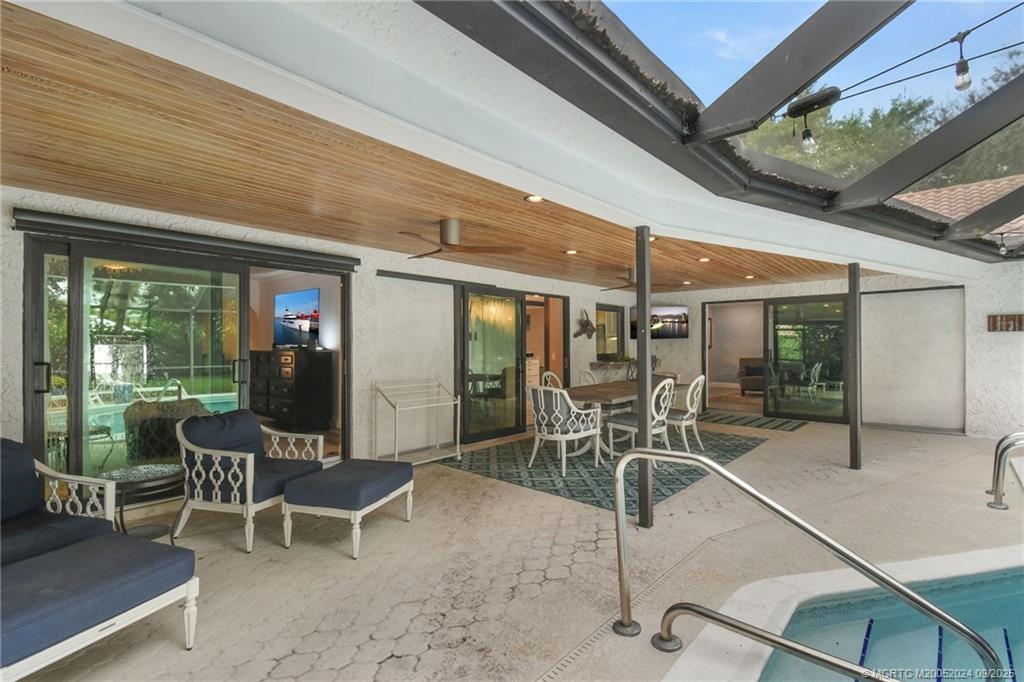 6 Copaire Road Sewall's Point, FL 34996 - Photo 20 of 76 a patio with table and chairs