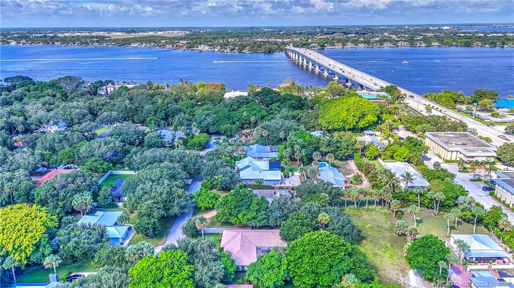 6 Copaire Road Sewall's Point, FL 34996 - Photo 2 of 76 an aerial view of a city with lots of residential buildings